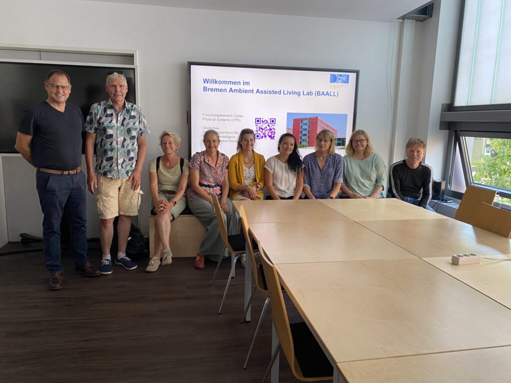Gruppenfoto mit neun Personen